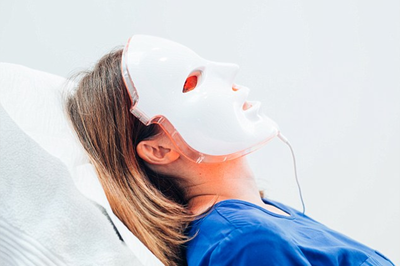 woman having LED face mask